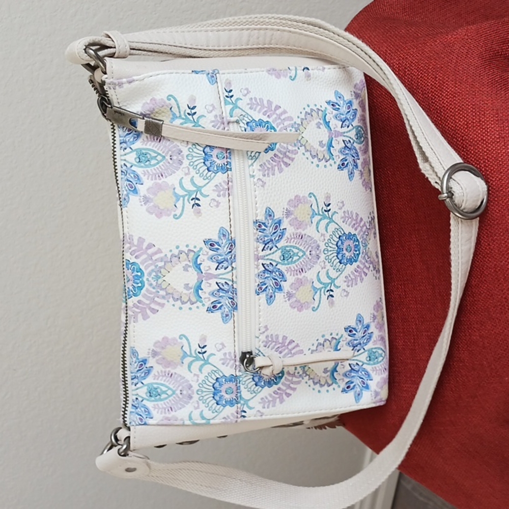 Floral Leather Crossbody by The Sak  Like new  All charms /logo fob Clean lining